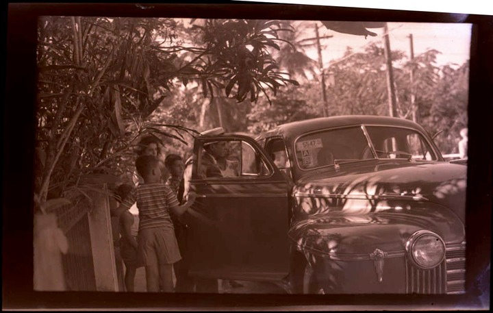 family getting into car 1942 